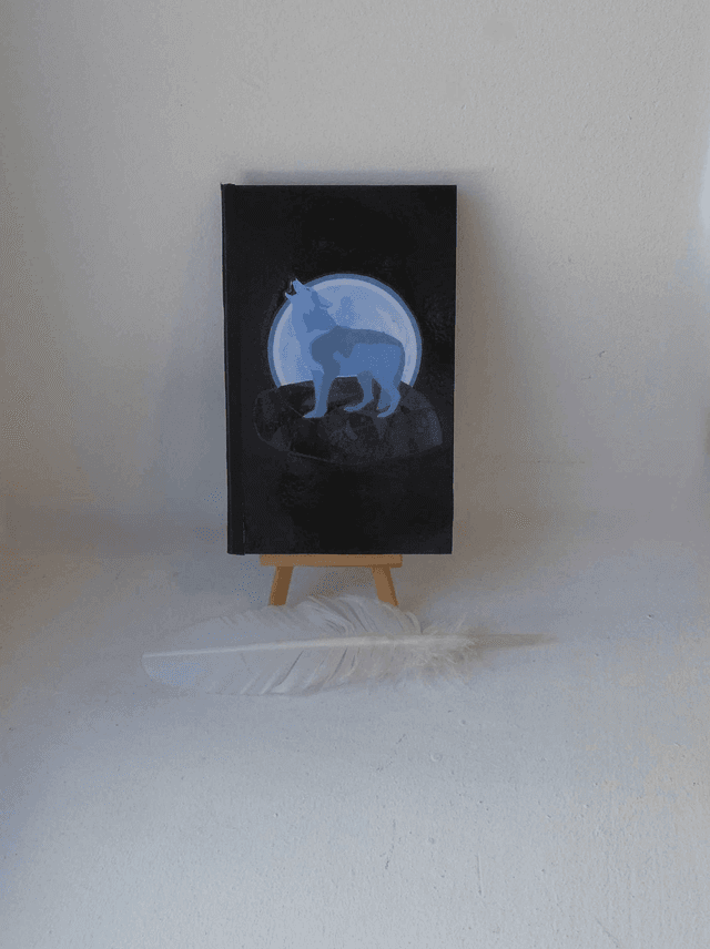 Le petit carnet quadriller aux loups hurlant à la lune