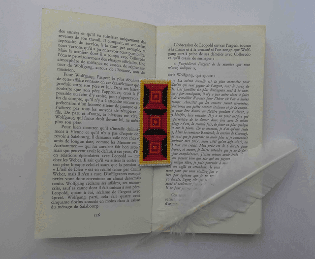 Le marque-page rougeoyant 
