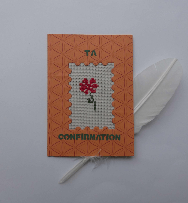 La fleur brodée de confirmation